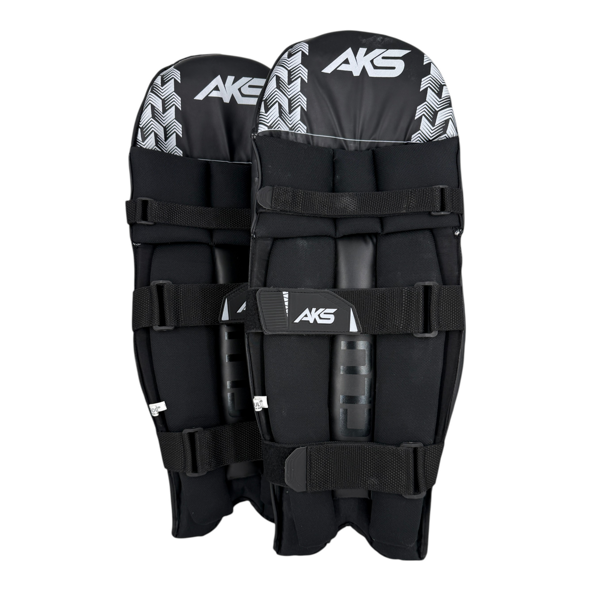 AKS CRICKET Club batting pads in black, featuring an ambidextrous design for adult cricket players.