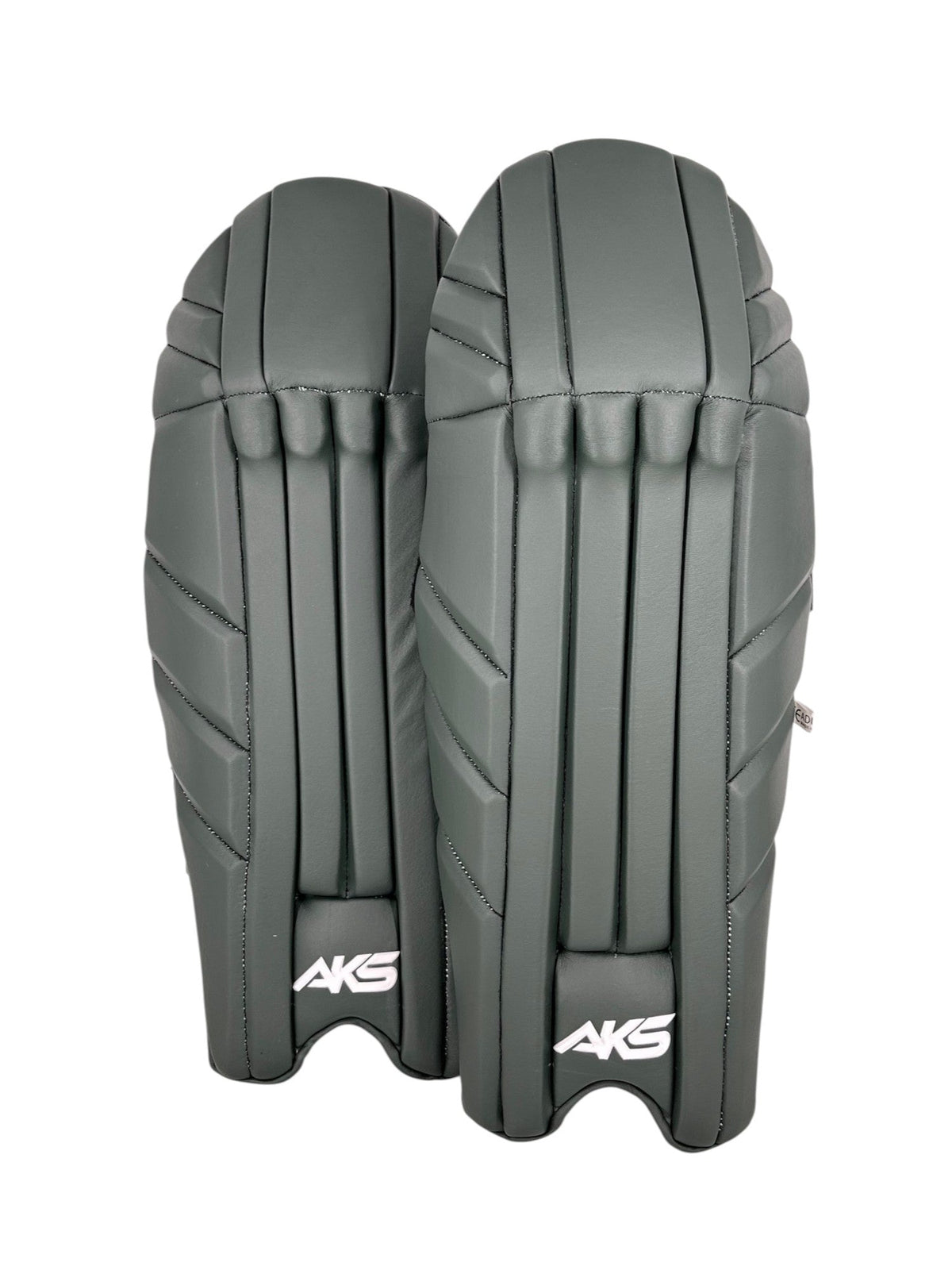 AKS CRICKET professional wicket-keeping pads in a sleek green finish with reinforced panels for impact protection.