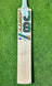 Jonty Master Grade-1 English Willow cricket bat with green and gold branding on a grass background