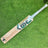 Jonty Masters Grade-1 English Willow cricket bat with white handle grip on green grass background