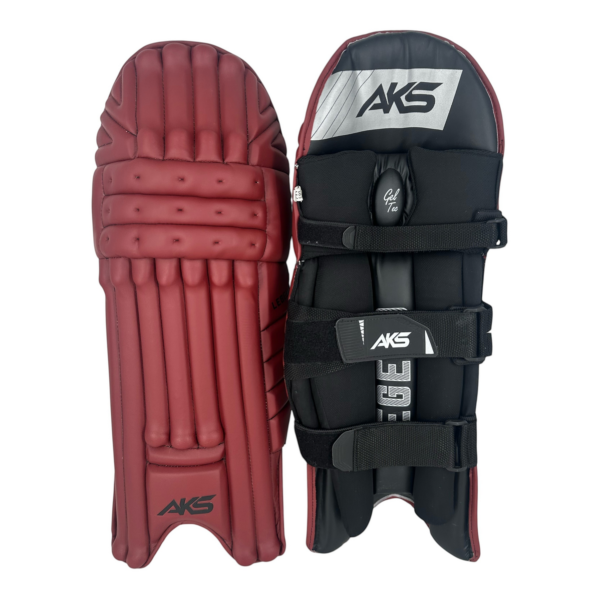 AKS CRICKET Legend maroon batting pads featuring a three-bolster face, moulded knee roll, and black adjustable straps.
