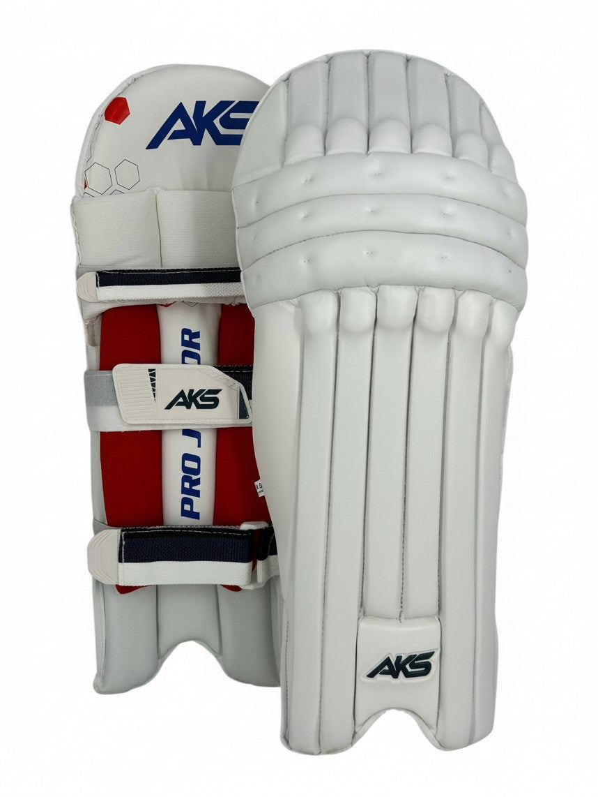 AKS CRICKET Pro Junior white cricket batting pads with red interior padding and secure adjustable straps