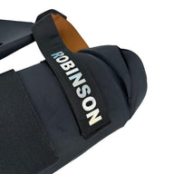 AKS CRICKET professional black thigh guard with holographic branding and adjustable elastic straps for cricket players