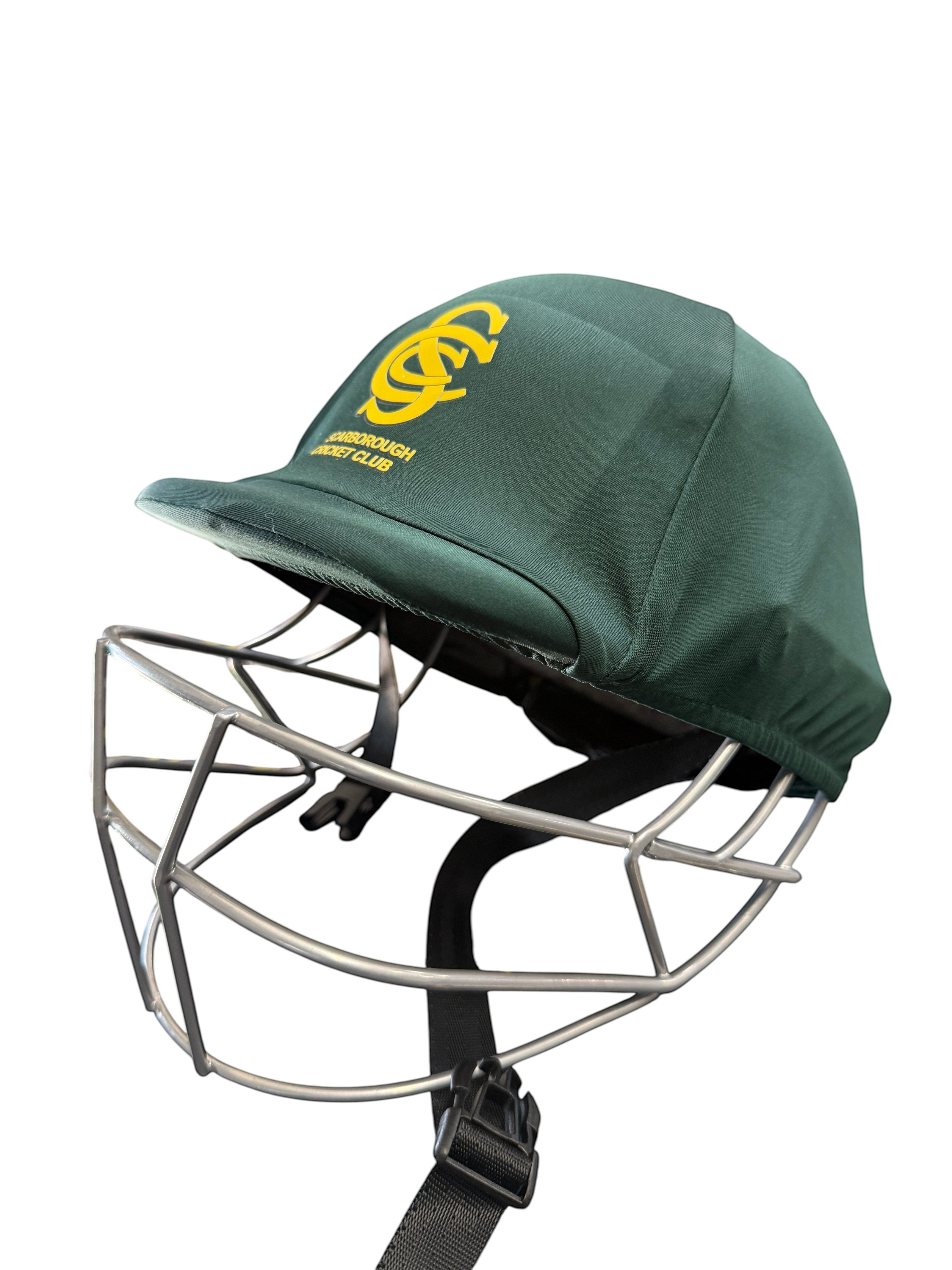 AKS CRICKET Scarborough District Cricket Club green helmet cover with yellow logo on a protective cricket helmet