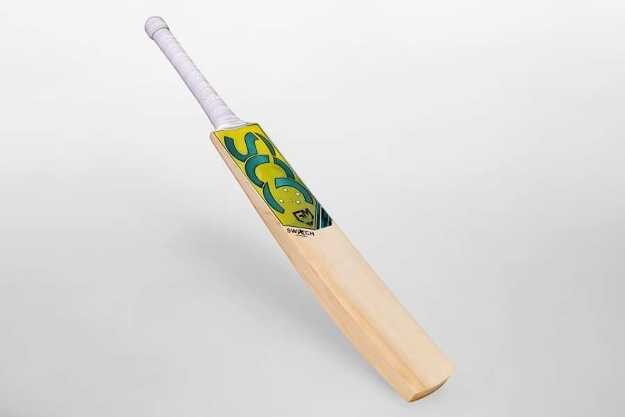 SCC SWITCH Rush Gold junior cricket bat made from English willow with yellow and green branding