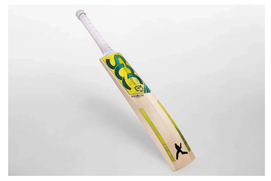 SCC SWITCH Rush Gold 675 junior English willow cricket bat with yellow and green graphics