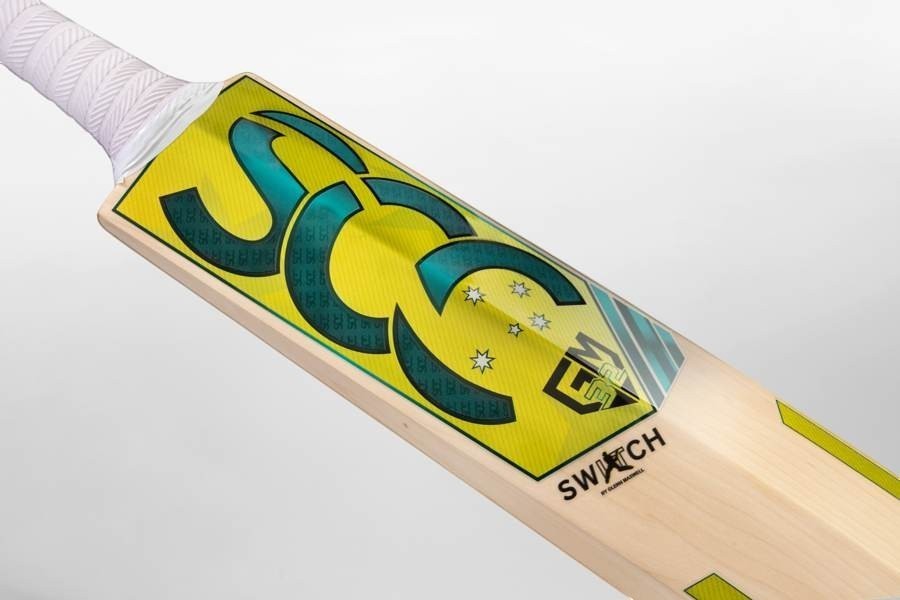 SCC SWITCH Rush Gold 675 junior English willow cricket bat with yellow and green branding