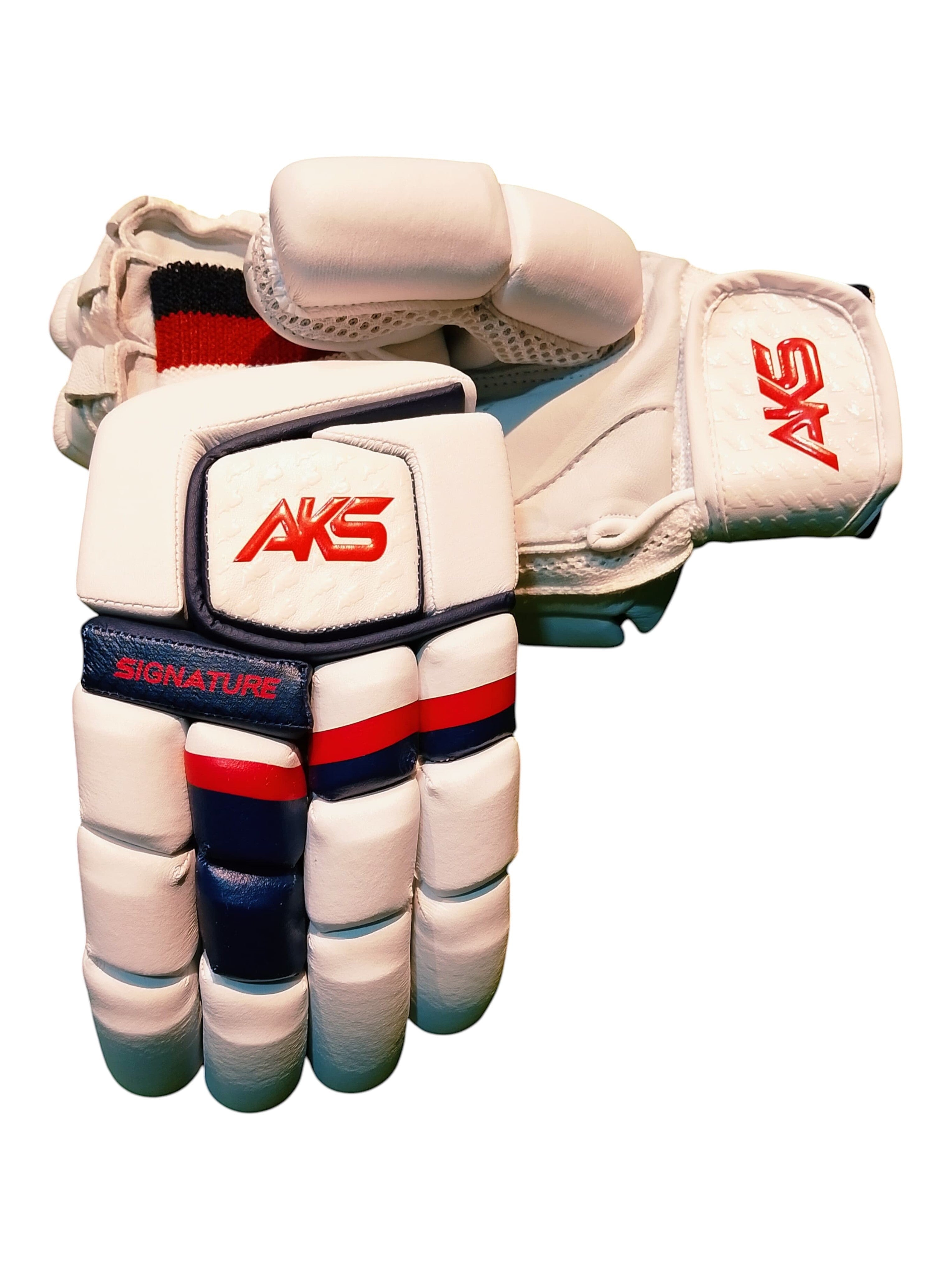 AKS CRICKET Signature batting gloves in white with navy and red accents, featuring high-density foam finger protection.