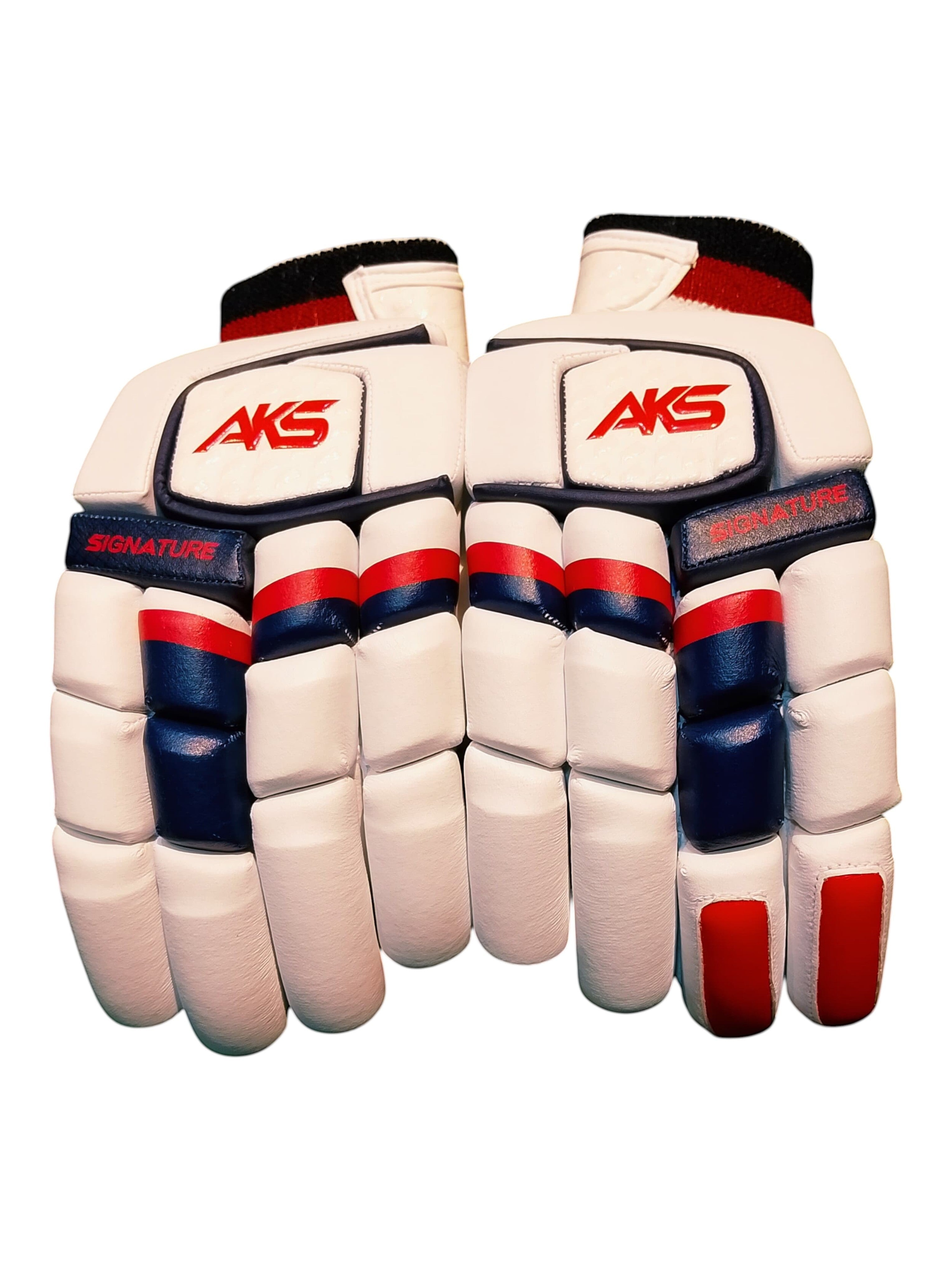 AKS CRICKET Signature batting gloves in white with navy and red accents, featuring high-density foam finger protection.