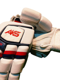 AKS CRICKET Signature batting gloves in white with navy and red accents, featuring high-density foam finger protection.